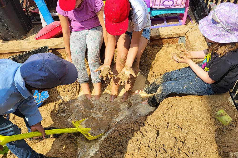 Children digging in a sandbox